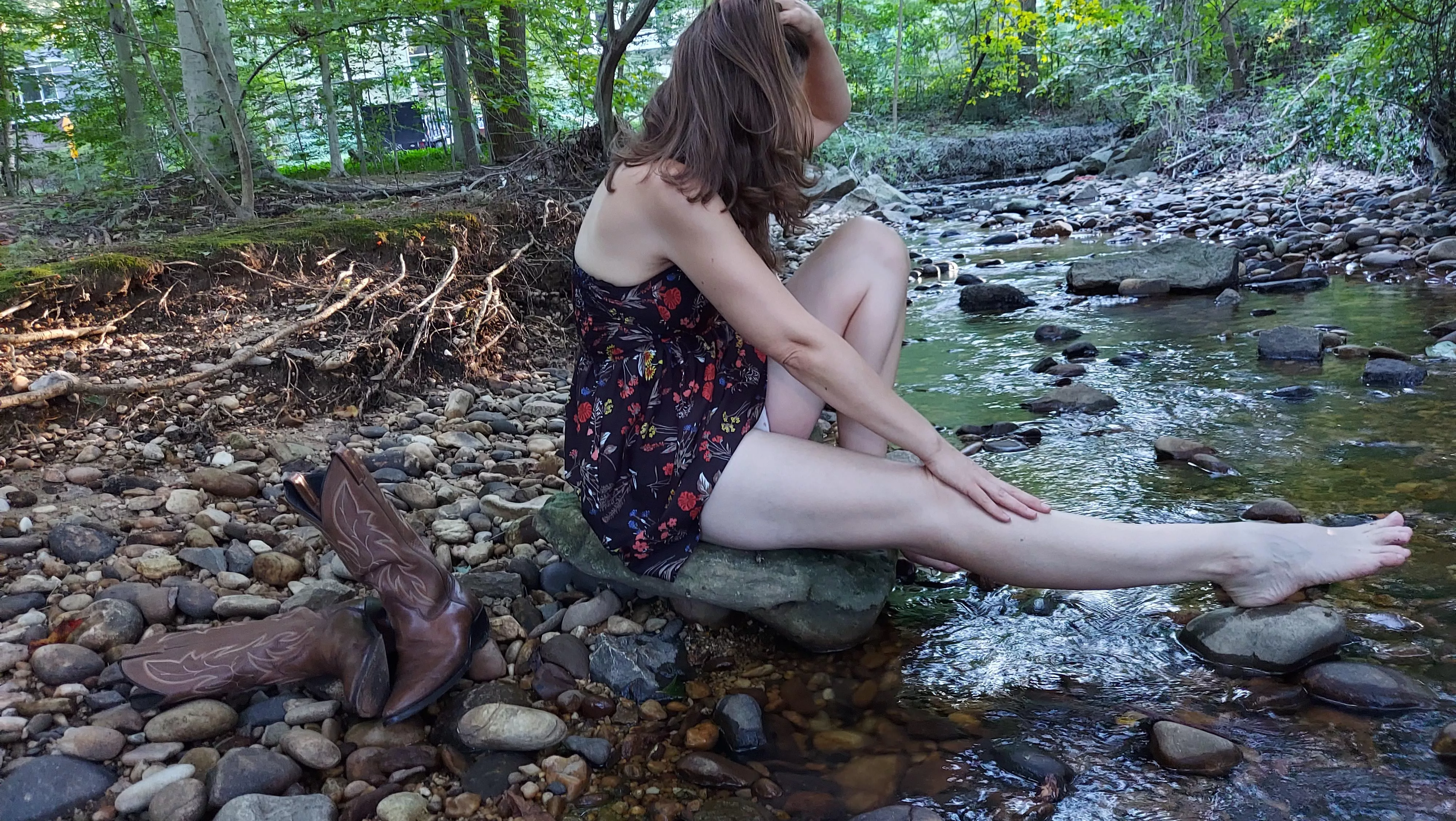 Relaxing by the water with my cowgirl boots 🥰