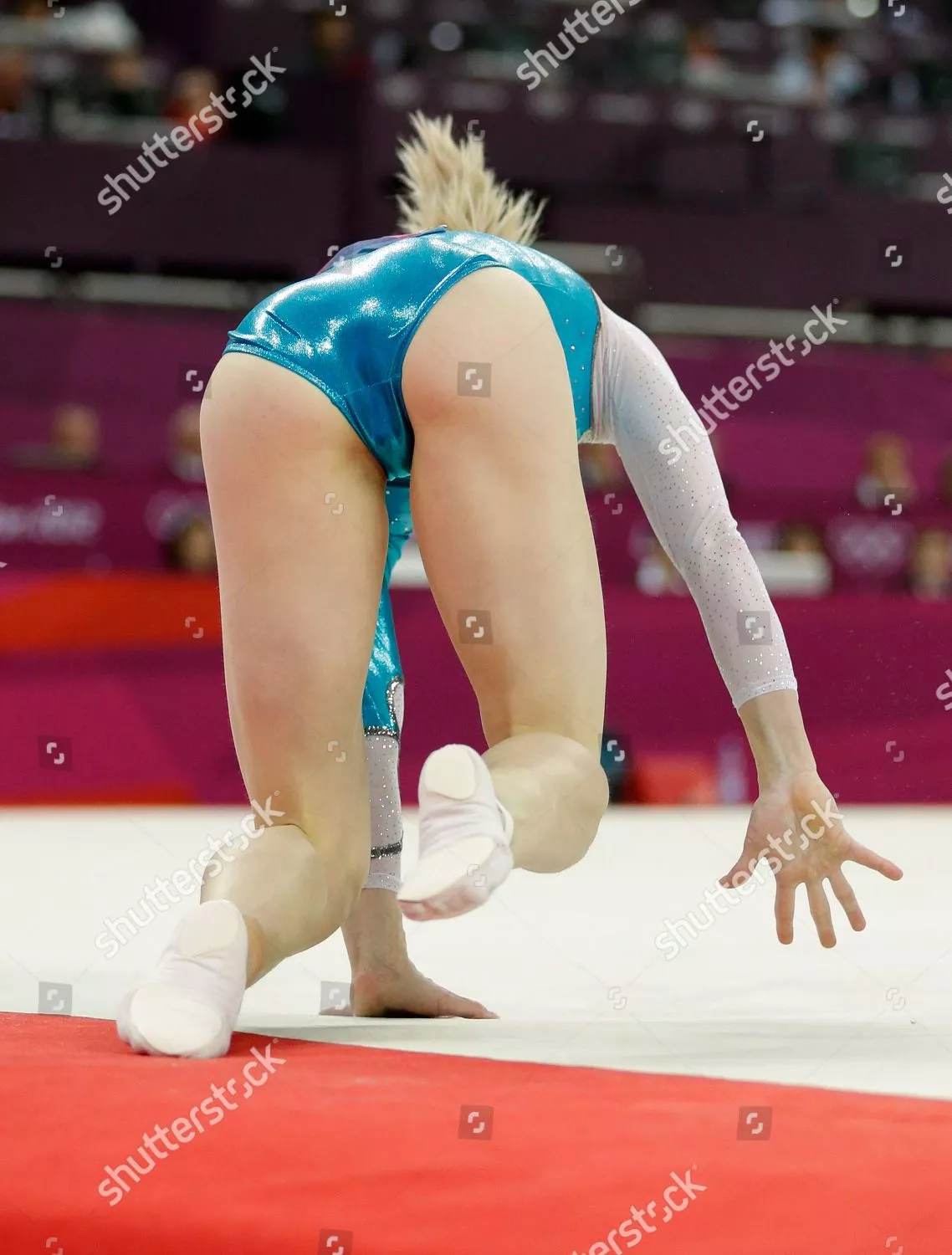 Romanian artistic gymnast Sandra Izbasa falling over