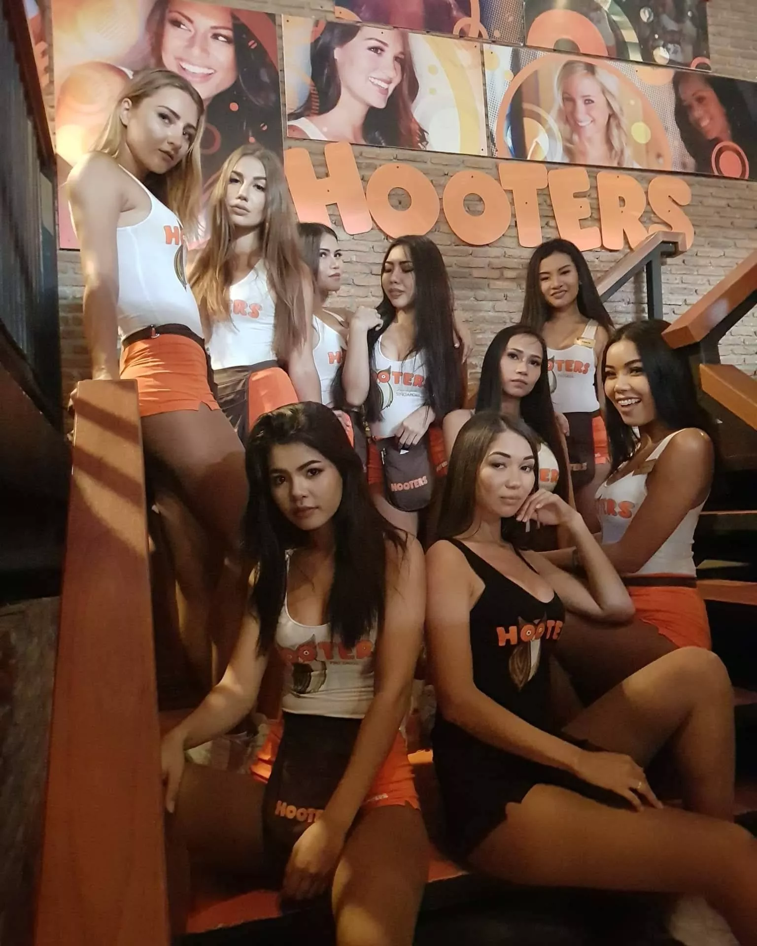 Sexy Thai waitresses inside Hooters in Phuket