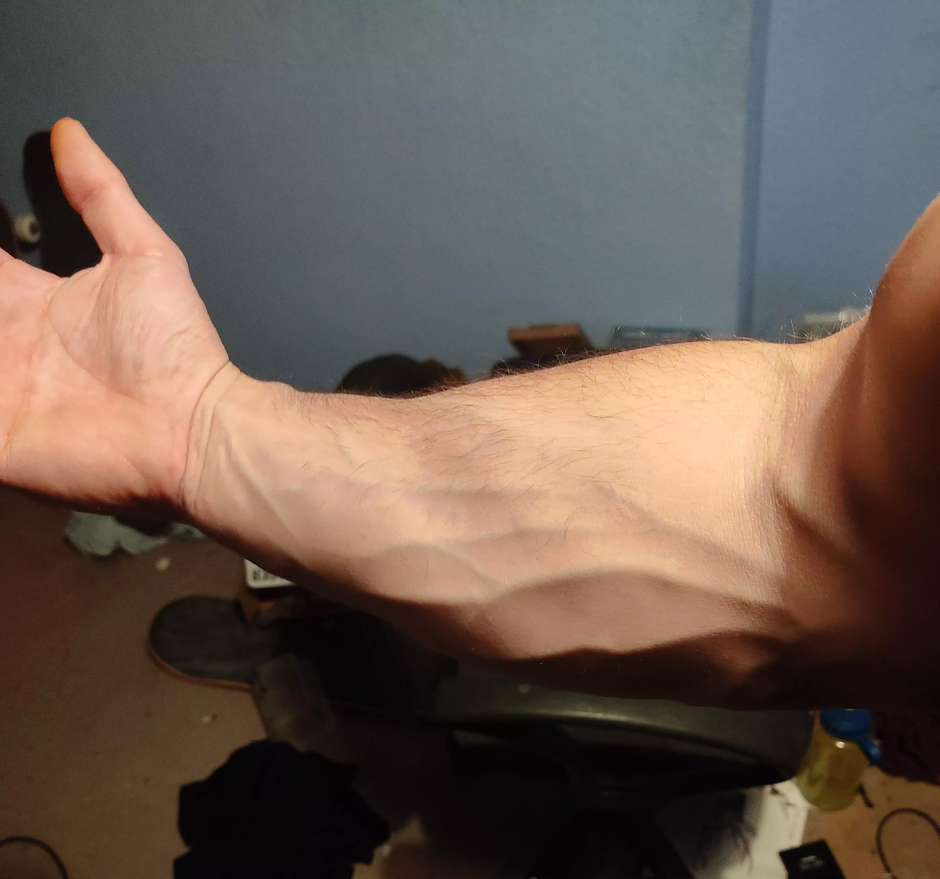 Should probably use these strong forearms to tidy my room .