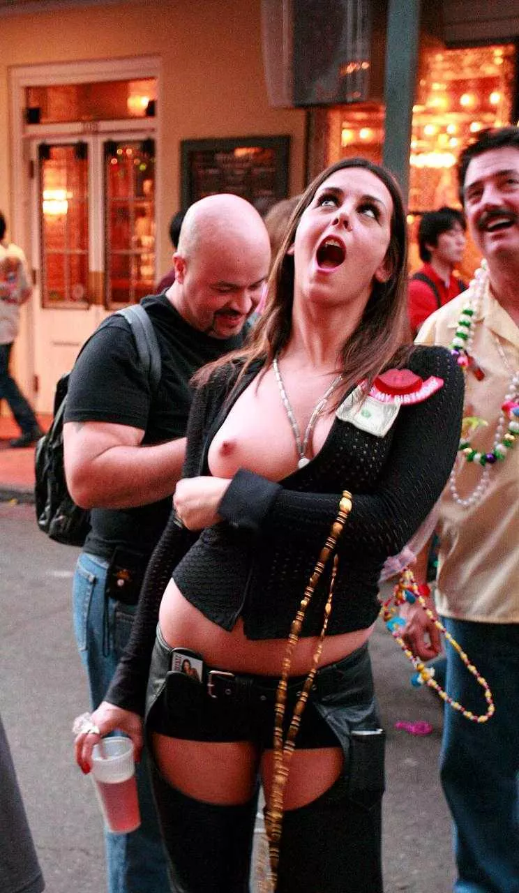 Showing one boob at Mardi Gras