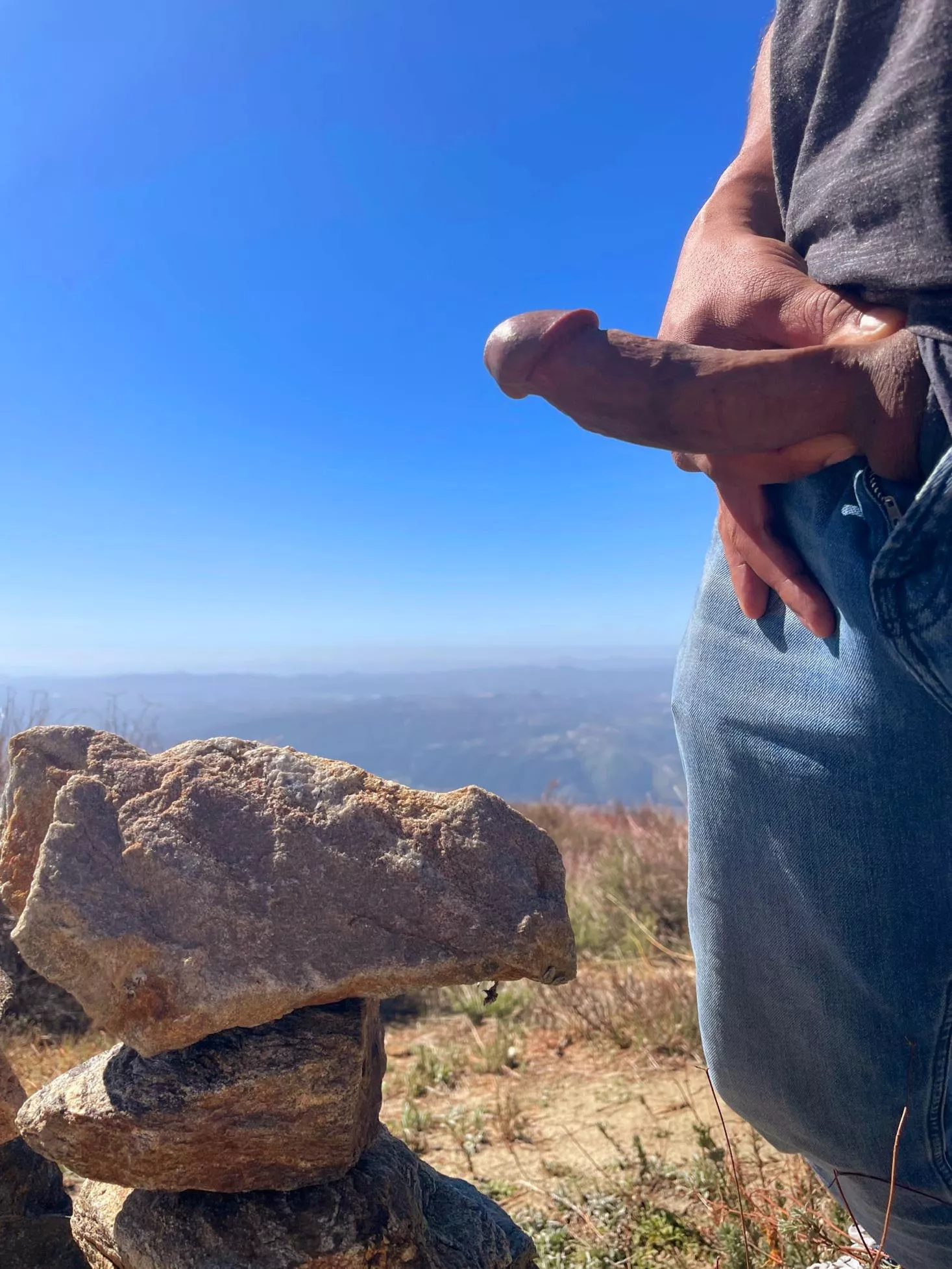 Stacking rocks and flashing cock.