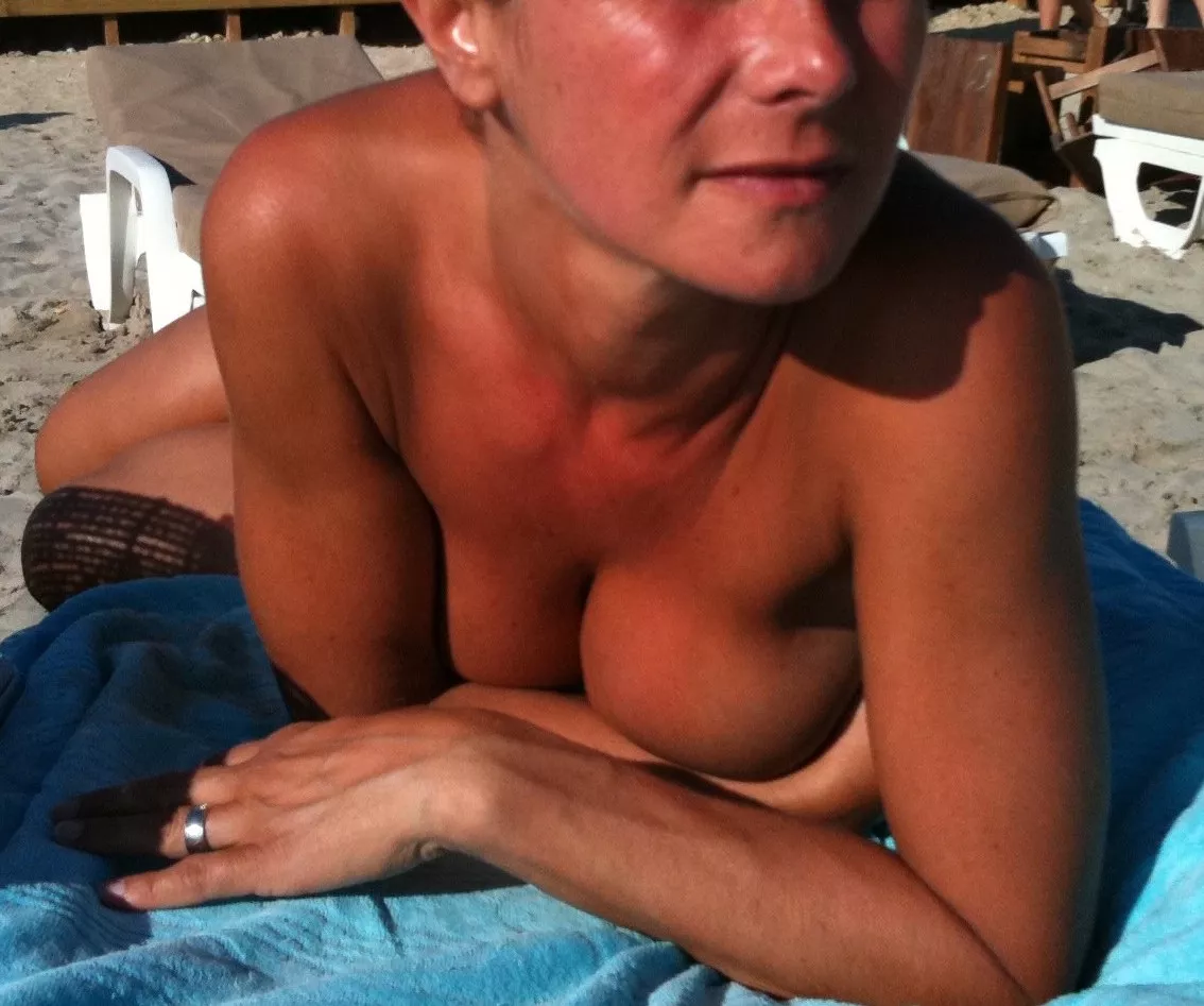 Tanning topless on the french riviera, showing my wedding ring as so many guyz were looking at me ;-)