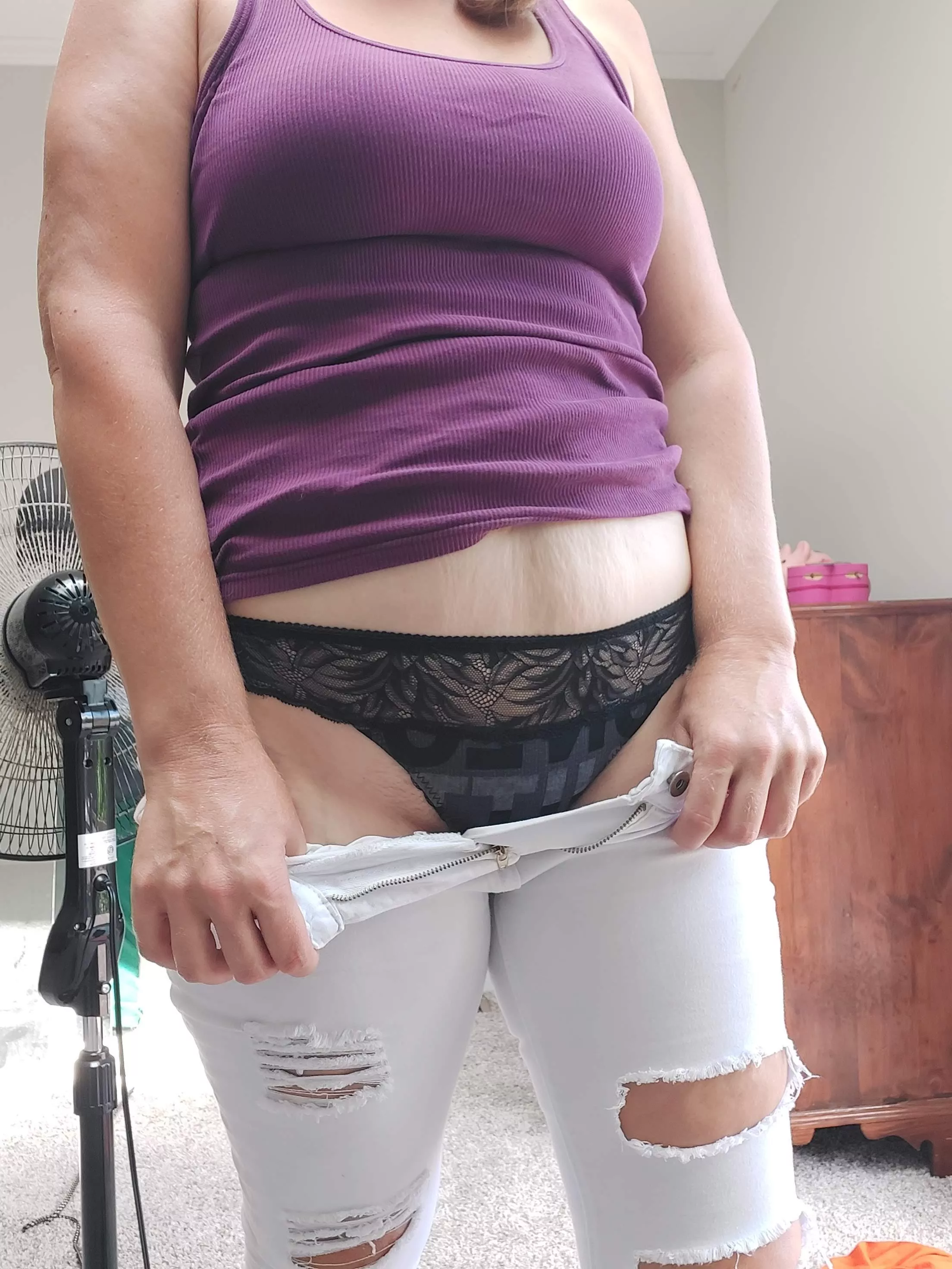 These white jeans really help to bring out this black thong