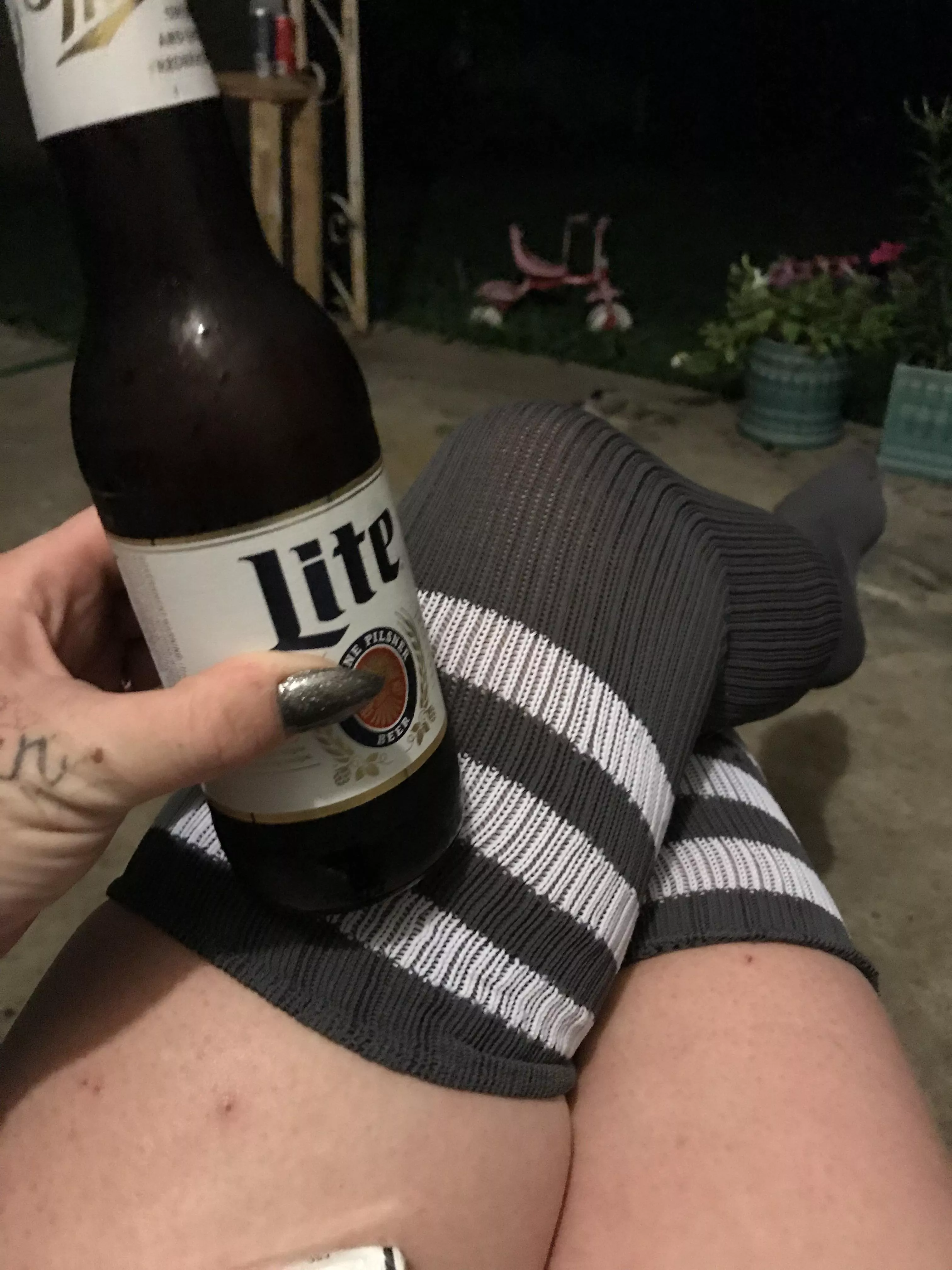 Thigh highs, a beer, good nails and hand tats. Iâ€™m hot even without my face in the pic ðŸ˜‰