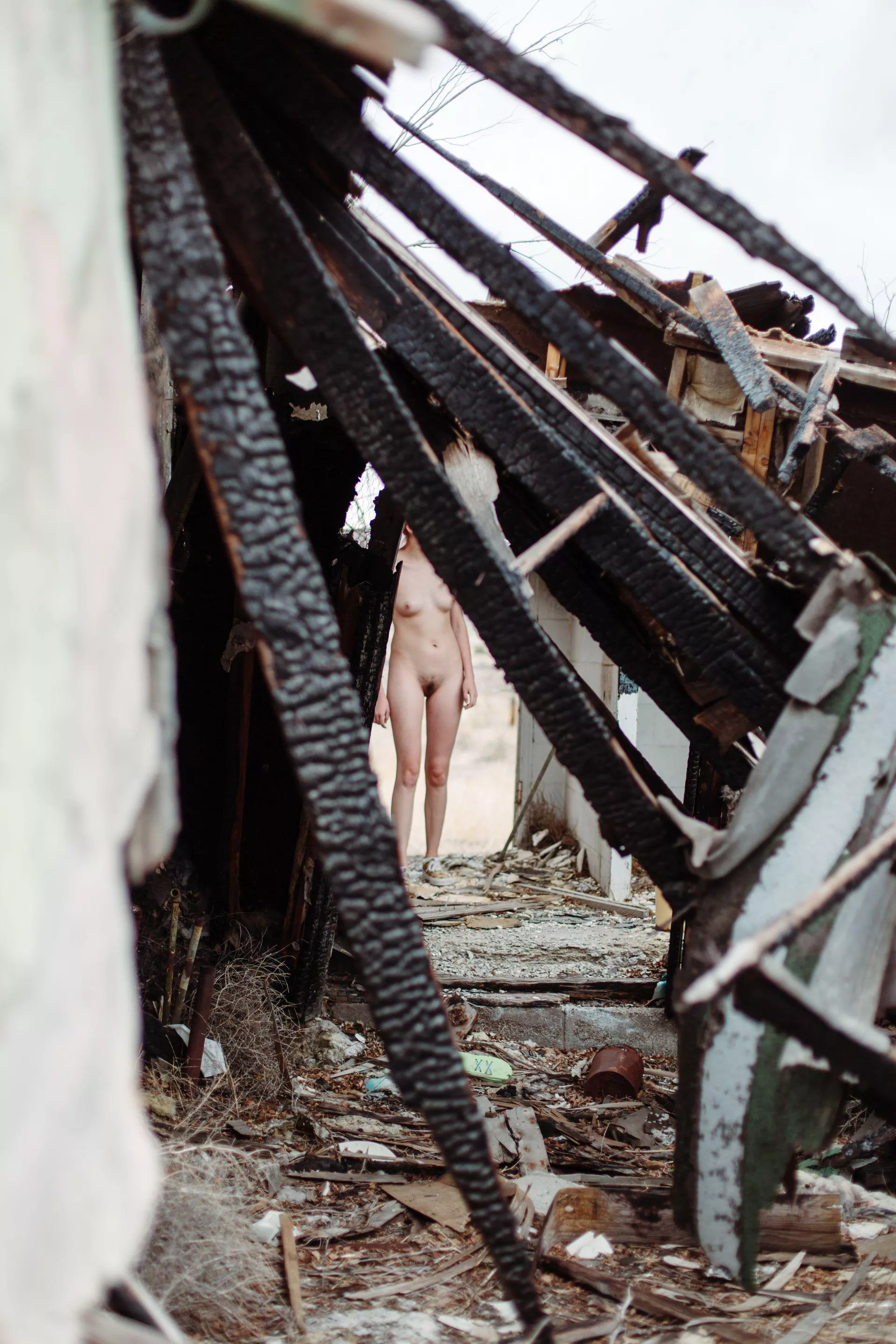 Thru the burnt building I go, for only my body to be seen.