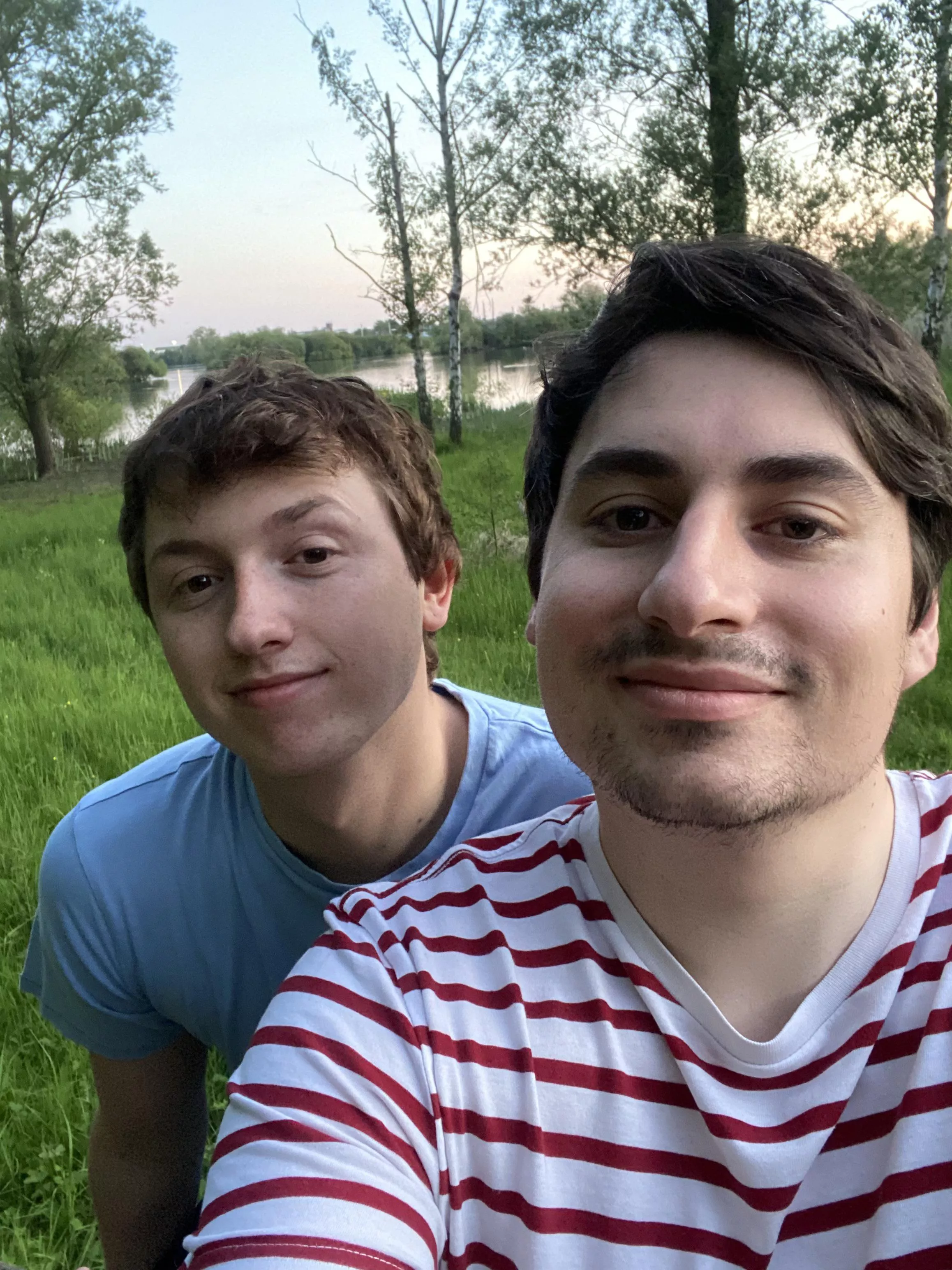 Two boys out for a walk in a park