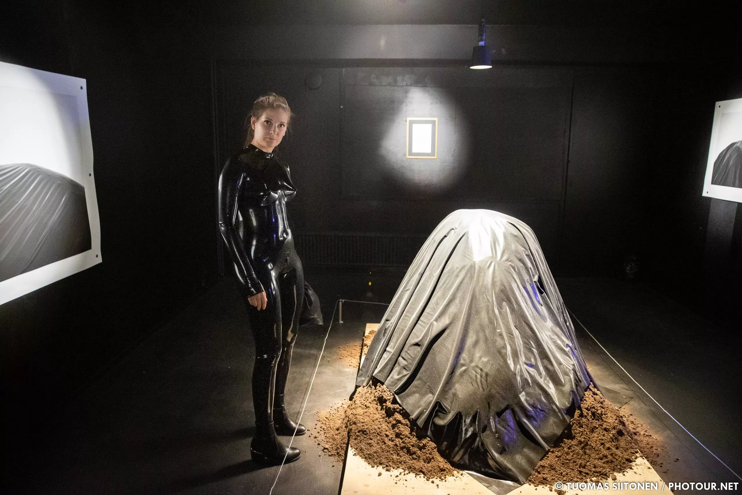 Wearing a latex catsuit to an art exhibition, we found a mound of dirt covered in latex as well