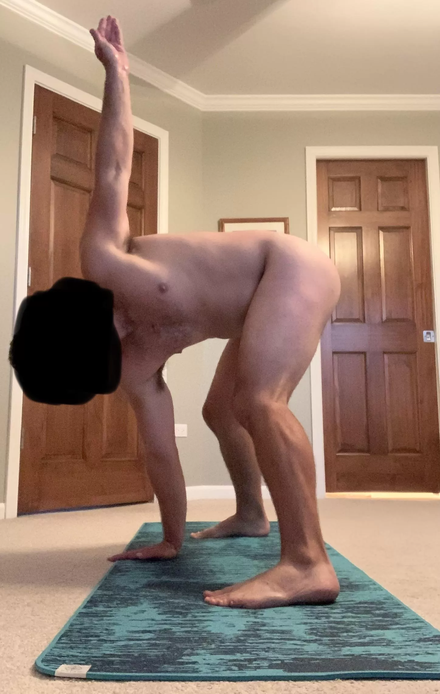 Wide-legged forward fold. Really helps warm up my lower spine for more vigorous activity.