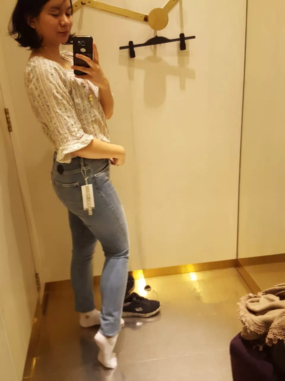 Wife trying on new jeans. (F25)