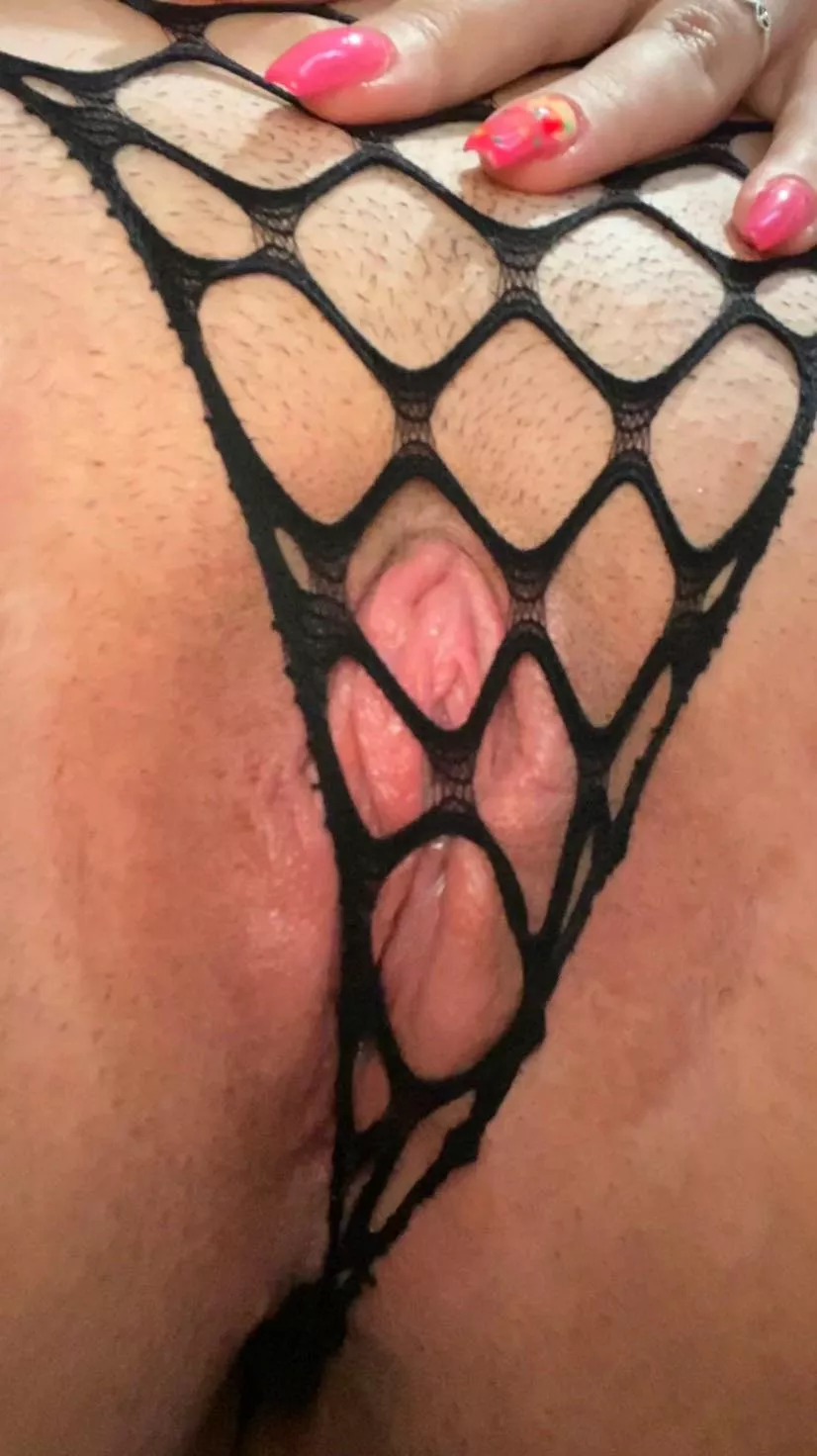 Would you play with my little pink pussy through my fishnet panties?